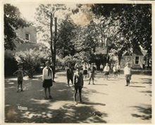 In front of little house (kindergarten bldg?)